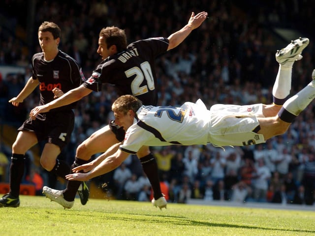 Richard Creswell puts Leeds United ahead with a diving header.