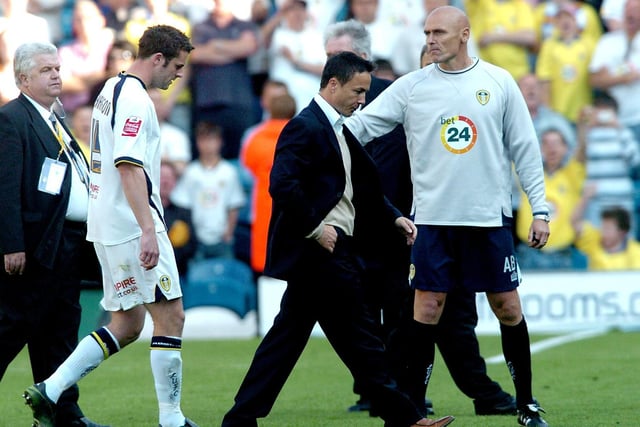 Manager Dennis Wise and Frazer Richardson trudge off the pitch at full-time.