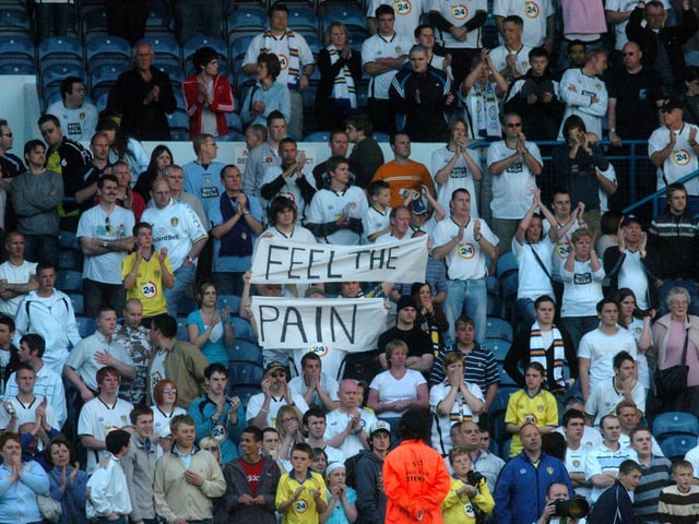 Fans with a banner in the Kop.