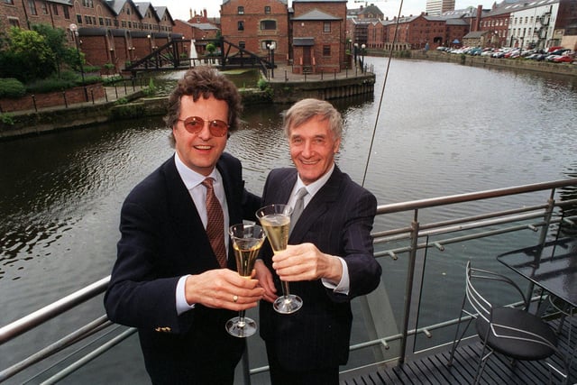 Restaurateur Michael Gill (left) with his one millionth customer, businessman Trevor Spencer, at Pool Court at The Calls.