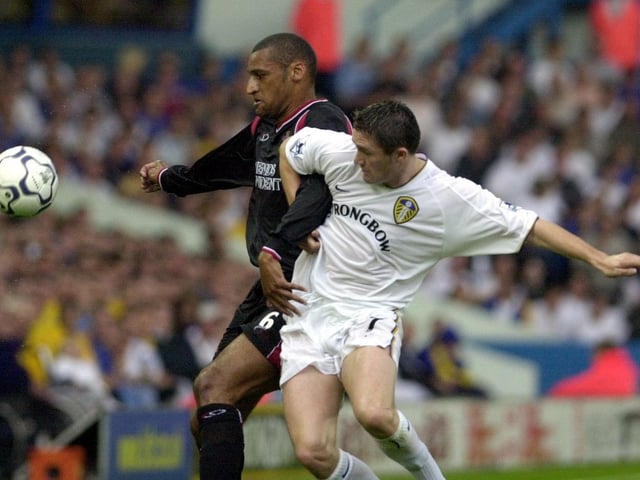 Robbie Keane tangles with Soputhampton's Dean Richards.
