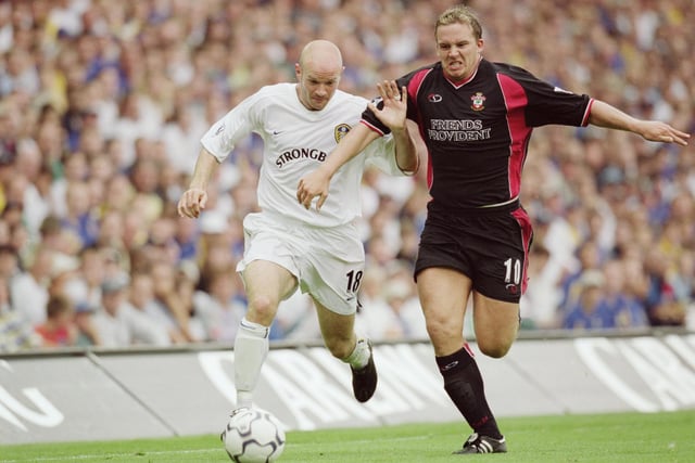 Danny Mills battles for the ball with Southampton striker Kevin Davies.