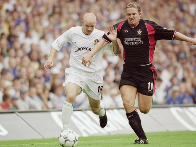 Danny Mills battles for the ball with Southampton striker Kevin Davies.