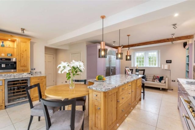 The open plan kitchen dining area is the hub of the house incorporating a spacious orangery, which extends the dining/living area to the guest wing and enhances natural light levels.