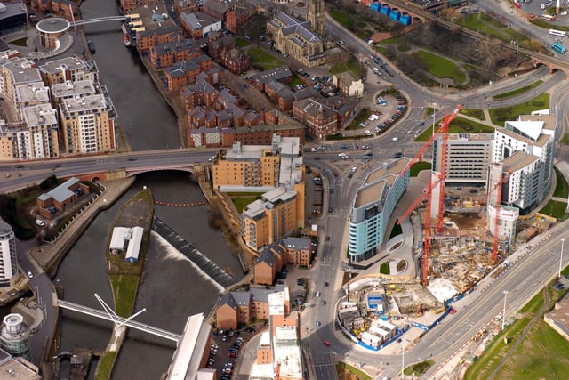 A view looking down over developments along the River Aire, near the weir and the new Etap Hotel.