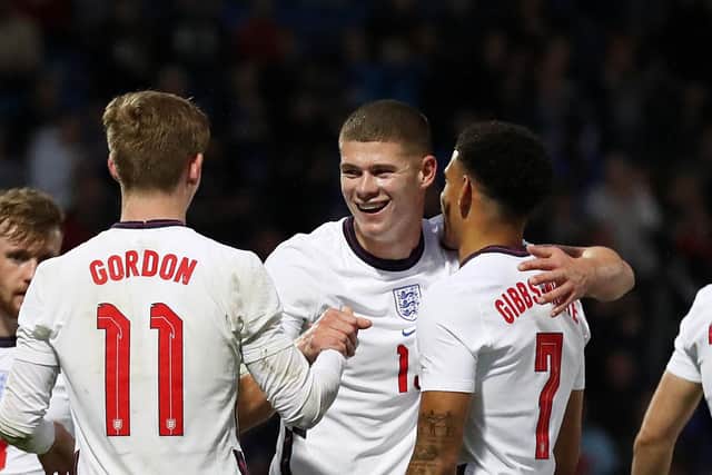 LIONS: Charlie Cresswell (C) is congratulated by his England U21 teammates after providing an assist for the side's second goal (Photo by Charlotte Tattersall - The FA/The FA via Getty Images)