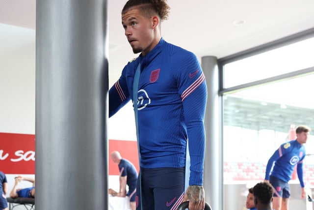 Another indoor gym session sees Phillips using resistance bands and kettle-bells to train his lower body (Photo by Eddie Keogh - The FA/The FA via Getty Images)