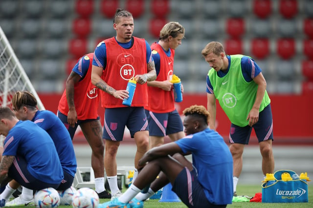 Alongside England teammates James Ward-Prowse (R) and Tammy Abraham (seated), Phillips takes time to re-hydrate (Photo by Eddie Keogh - The FA/The FA via Getty Images)
