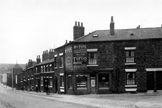 May 1958 and Barrack Street is on the left, looking towards Meanwood Road, crossing Sheepscar Street. At the corner with Cross Barrack Street is a bakers shop.