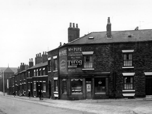 May 1958 and Barrack Street is on the left, looking towards Meanwood Road, crossing Sheepscar Street. At the corner with Cross Barrack Street is a bakers shop.