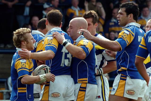 Rob Burrow is congratulated after scoring against Warrington in the 2005 Powergen Cup. Picture: Steve Riding.