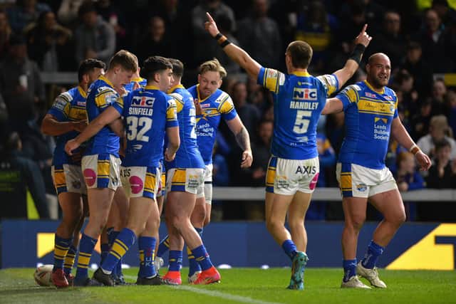 Morgan Gannon is congratulated by team-mates after scoring against Hull KR thi season.  Picture: Bruce Rollinson.