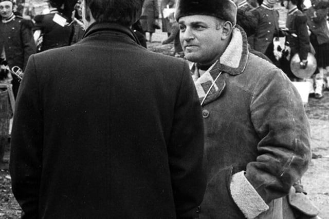 Film director John Schlesinger (facing camera) during the shooting of his film 'Billy Liar'. This scene was shot on a cleared area off Green Lane where old terraced houses had recently been demolished.
