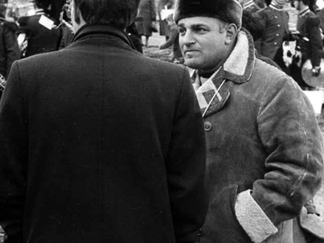 Film director John Schlesinger (facing camera) during the shooting of his film 'Billy Liar'. This scene was shot on a cleared area off Green Lane where old terraced houses had recently been demolished.