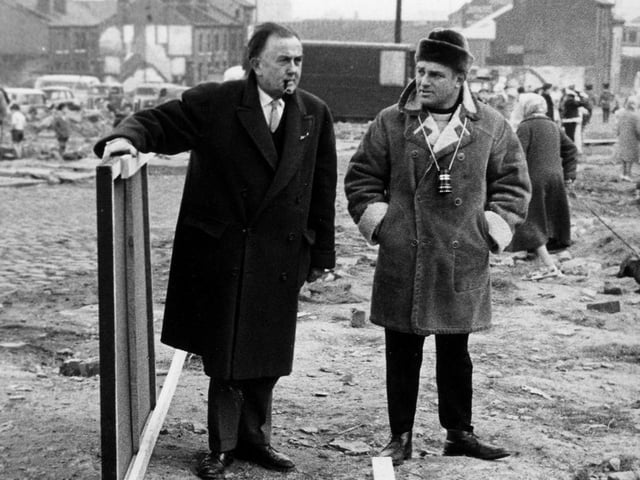 The set of the film on a cleared site off Green Lane. On the right is director John Schlesinger.