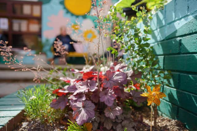 The garden includes a courtyard, benches and plenty of sensory plants, herbs and flowers to help the children engage with nature. Photo by Tony Gent Visual Studio.