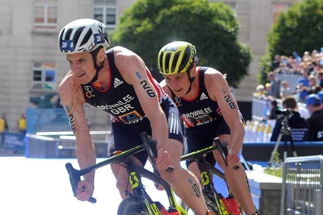 Jonny Brownlee leads his brother Alistair on the bike in the Elite Mens Race through Millennium Square in 2017. Picture: Tony Johnson.