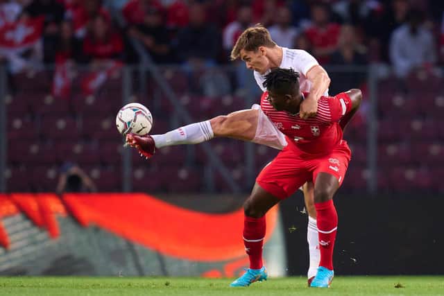 ASSURED: Leeds United's Diego Llorente beats Switzerland striker Breel Embolo to the ball during Thursday night's Nations League clash in Geneva.
Photo by Harry Langer/DeFodi Images via Getty Images.