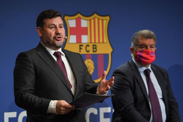 DIFFICULTY: Barcelona's economic vice president Eduard Romeu (L) alongside club president Joan Laporta (R) (Photo by LLUIS GENE/AFP via Getty Images)