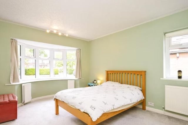 On ground level is a large double bedroom and modern house bathroom.