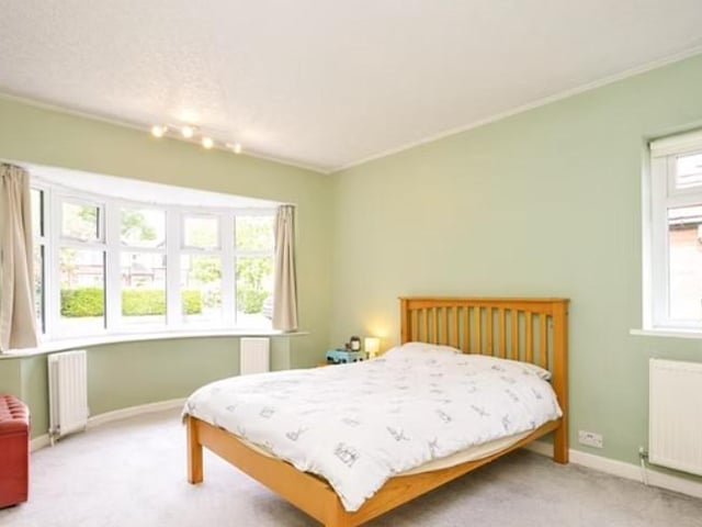 On ground level is a large double bedroom and modern house bathroom.