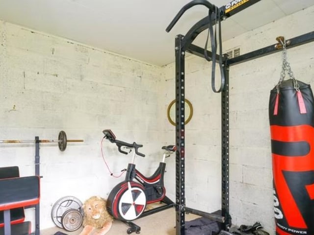 There is also a garage with power and light, and a further out building currently used as a gym.