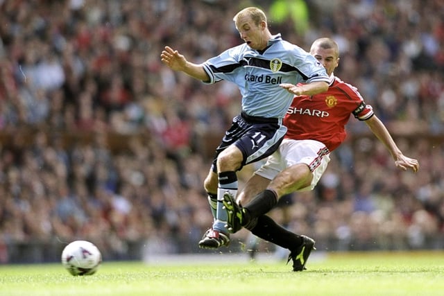 Lee Bowyer is challenged by Manchester United's Roy Keane  during the FA Carling Premiership clash at Old Trafford in August 1999.