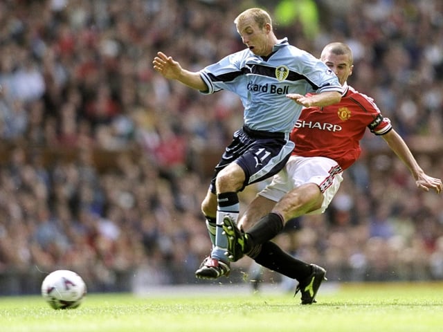 Lee Bowyer is challenged by Manchester United's Roy Keane during the FA Carling Premiership clash at Old Trafford in August 1999.