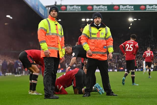 FIRM MESSAGE: From the Premier League in order to tackle the throwing of missiles, pyrotechnics and pitch invasions. Manchester United's Anthony Elanga, centre, was hit by an object in last season's clash at Elland Road. Photo by PAUL ELLIS/AFP via Getty Images.
