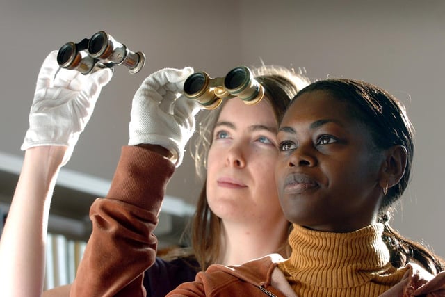 A new exhibition named Discovering Leeds was on show at the Leeds Central Library in February 2005. Pictured are library staff, from left, Beverly Moslim and Beverly Richardson with early 20th century opera glasses.