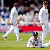 England's Zak Crawley on the ground after dropping the ball during day one of the Second Test at Trent Bridge Picture: Mike Egerton/PA