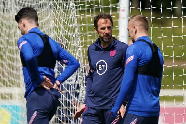England's manager Gareth Southgate chats with Jarrod Bowen (right) during a training session at St George's Park Picture: Joe Giddens/PA