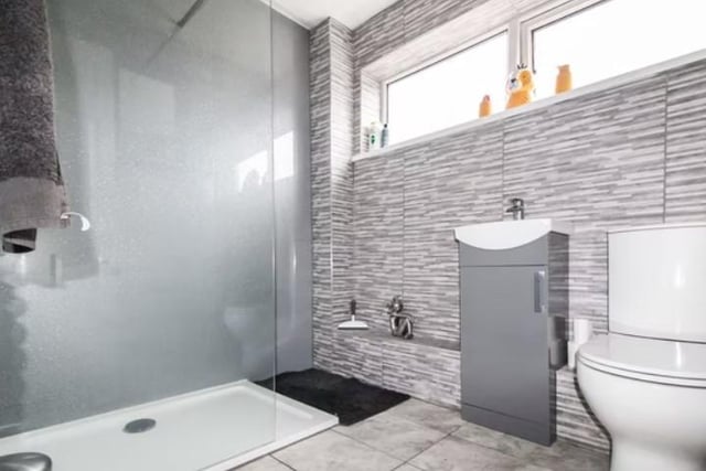 On the first floor is the family bathroom that has a beautiful walk-in shower.