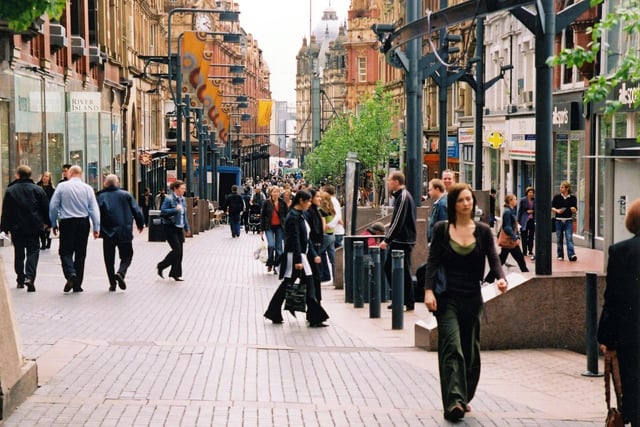 Albion Place looking East towards Briggate in May 2005. On the left is River Island fashions by the junction with Lands Lane; next to this is Costa Coffee coffee shop. Shps on the right include All-sports sports goods, Pasta Romagna cafe and Wallace Arnold travel agents.