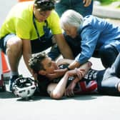 Down and out: Jonny Brownlee is attended to by medics after a nasty crash left him with a broken elbow in his home World Triathlon race. Picture: Jonathan Gawthorpe)