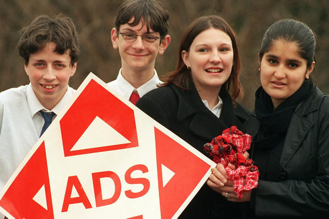 Pupils launched two young enterprise companies in February 1999. Pictured, from left, are Mark Williamson and Mathieu Ward with a logo of their company while Nicola Tansey and Adeeba Akhtar holding some of their hair products.