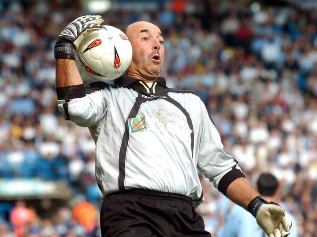 Goalkeeper Bruce Grobbelaar makes a save.
