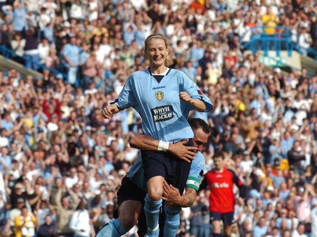 Vinny Jones chases after Lucy Ward after she scored.