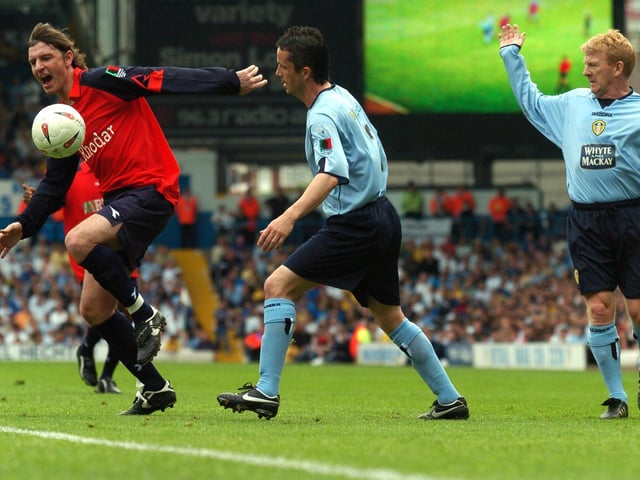 Lee Sharpe goes past Gary Kelly and Gordon Strachan.