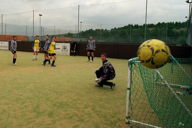 Around 60 five-a-side football teams took part in 'The Gold Cup 1999' a one day tournament at South Leeds Stadium. Pictured is goalkeeper Matthew Otley (Mary Poppins, Rothwell) beaten by a free-kick from Darrel Cameron. (Crazy Gang, Ossett). The ball went wide of the post.