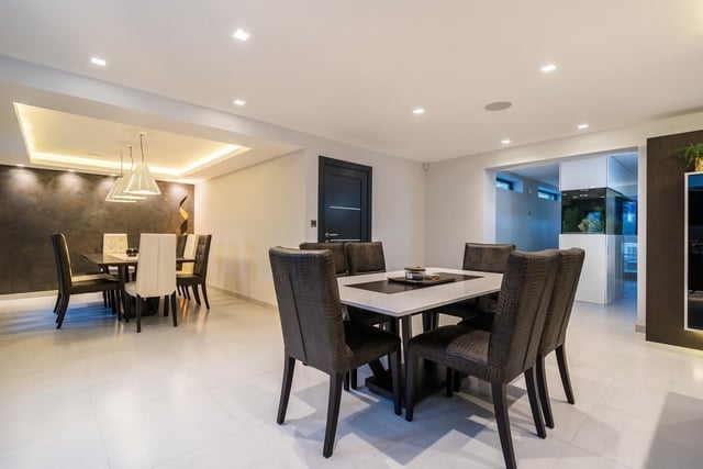 Dining tables and chairs within the property's flexible and open plan areas.