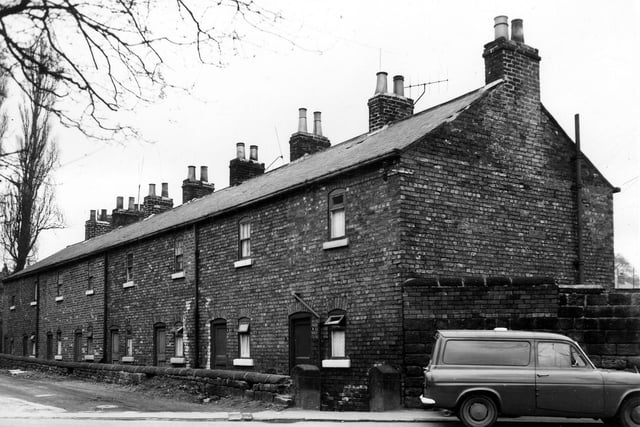 Seen from Green Road, this view looks onto ther back entrances to houses on Brick Row in March 1966.