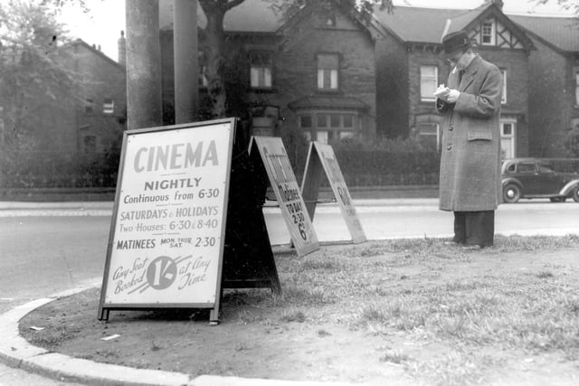 Advertising boards for the Corner House cinema on junction of Street Lane with Harrogate Road in May 1939.