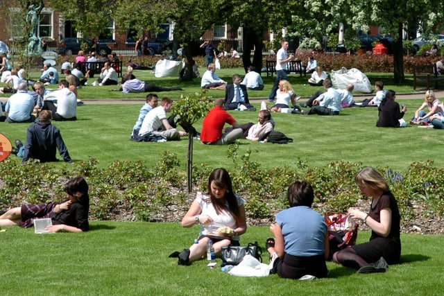 Office workers enjoy the weather in the newly re-opened Park Square in May 2006.