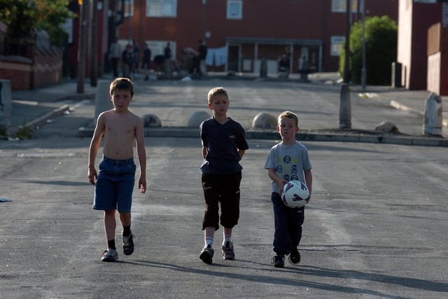 Kids play football on the streets of East End Park in June 2006.
