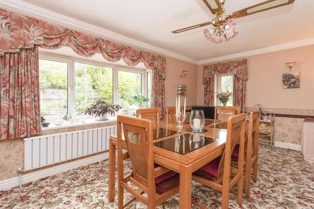 The dining room with garden views is flexible space.