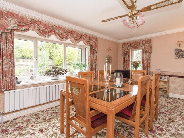 The dining room with garden views is flexible space.