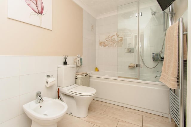 Bath, shower and bidet are included in this bathroom suite.