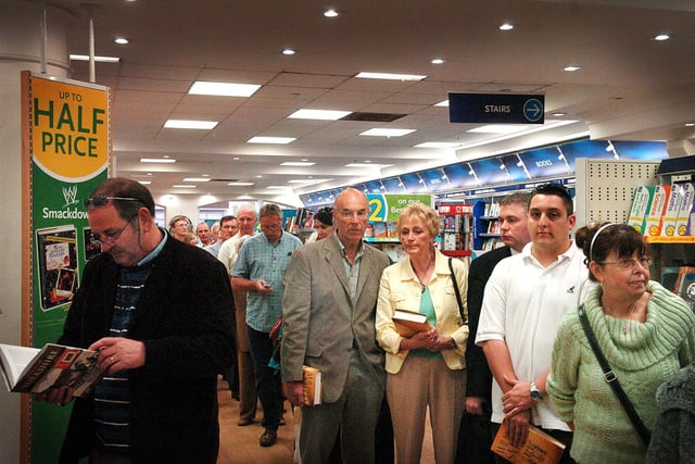 Fans of Wilbur Smith, queue up to have copies of his latest novel, The Quest, signed by the author at WH Smith's in April 2007.