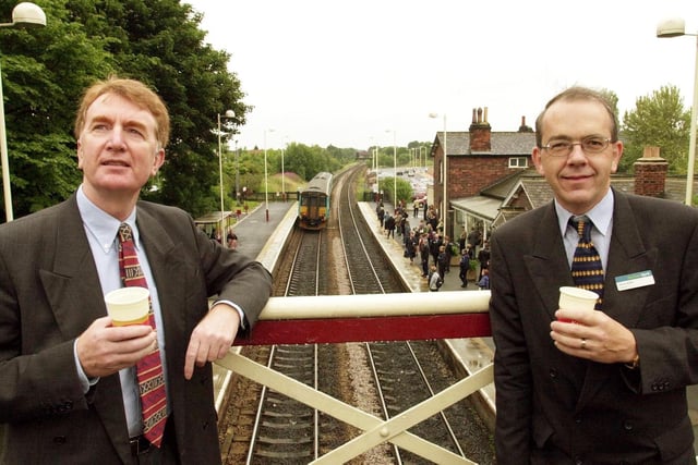 Colin Burgon MP for Elmet (left) with Stuart Baker, deputy managing director of Northern Spirit, toast the opening of the refurbished Garforth station with a cup of coffee in July 2000.